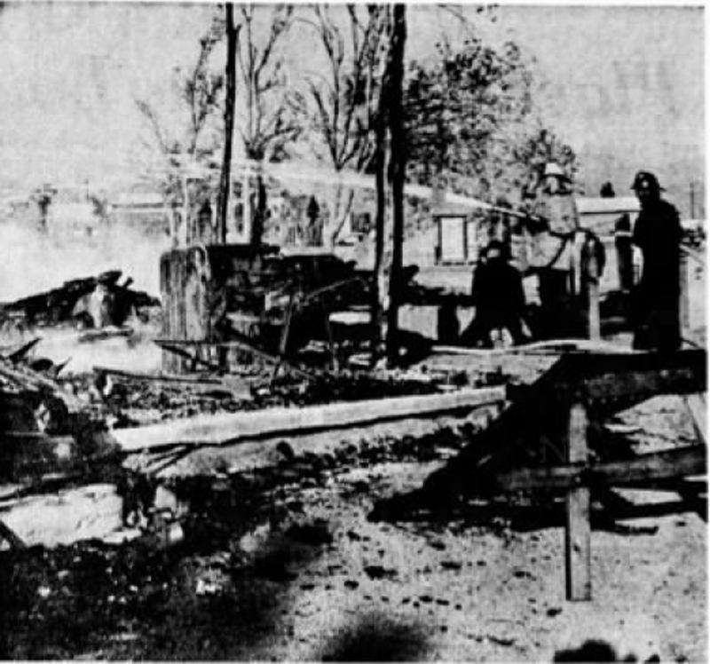 CHARRED RUINS — Firemen dampen the smoldering ruins of the Golden Stallion, Pioneertown restaurant which burned down yesterday.