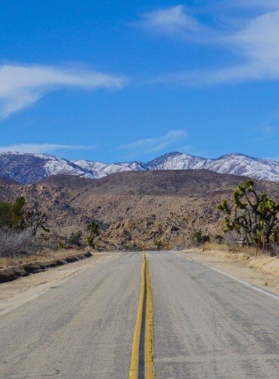 Pioneertown Road and snowy mountains photo